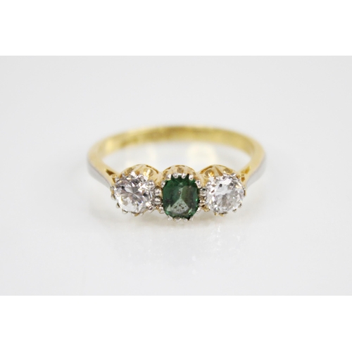 137 - A diamond and garnet topped doublet ring, the central green coloured mixed cut garnet topped doublet... 