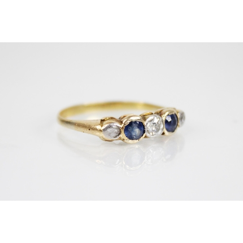 146 - An early 20th century sapphire and diamond five stone ring, designed as a central round mixed cut di... 