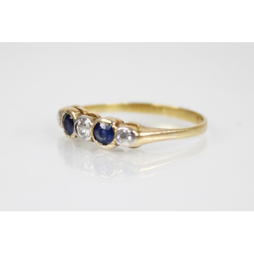 146 - An early 20th century sapphire and diamond five stone ring, designed as a central round mixed cut di... 