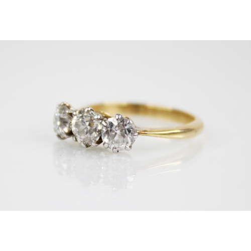 149 - A diamond three stone ring, the central round old cut diamond weighing approximately 0.50 carats (4.... 