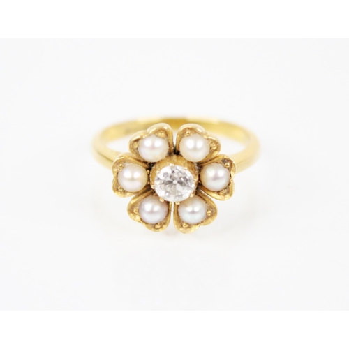 150 - A Victorian pearl and diamond floral ring, comprising a central old cut diamond weighing approximate... 