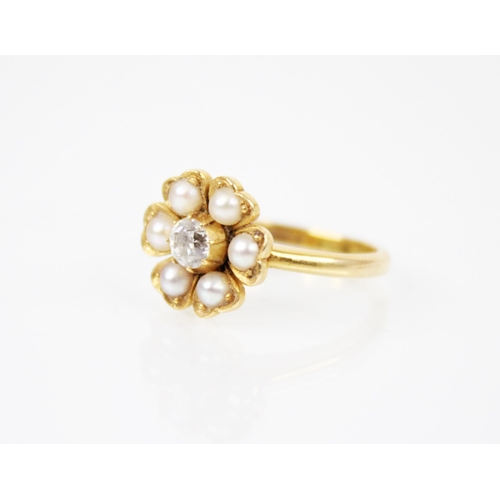 150 - A Victorian pearl and diamond floral ring, comprising a central old cut diamond weighing approximate... 