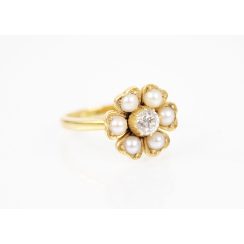 150 - A Victorian pearl and diamond floral ring, comprising a central old cut diamond weighing approximate... 