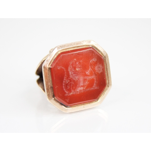 160 - A 19th century carnelian set seal fob, matrix engraved with a crest depicting a lion with two tails,... 