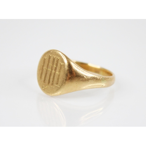 202 - A gold coloured signet ring, the circular matrix with monogrammed initials, 14mm x 11mm, continuing ... 