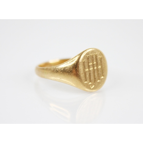 202 - A gold coloured signet ring, the circular matrix with monogrammed initials, 14mm x 11mm, continuing ... 