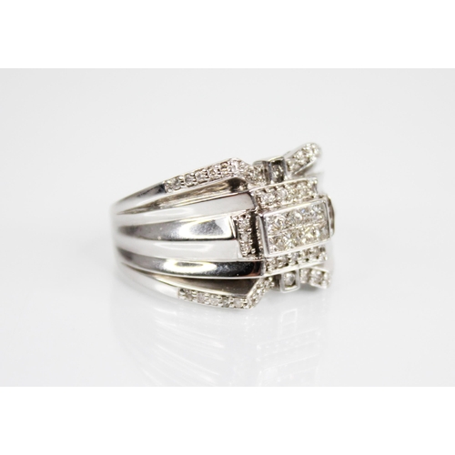 208 - A 14ct white gold diamond set ring, the central rectangular panel set with eight princess cut diamon... 