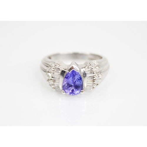 212 - A tanzanite and diamond 18ct gold Iliana ring, the central pear shaped tanzanite measuring 8mm x 6.2... 