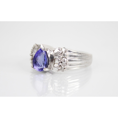 212 - A tanzanite and diamond 18ct gold Iliana ring, the central pear shaped tanzanite measuring 8mm x 6.2... 