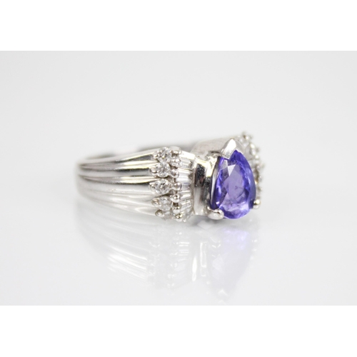 212 - A tanzanite and diamond 18ct gold Iliana ring, the central pear shaped tanzanite measuring 8mm x 6.2... 