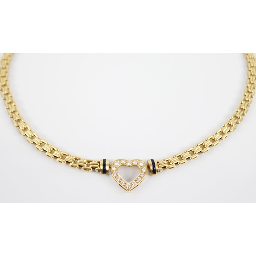 221 - An 18ct gold diamond and sapphire necklace, the pierced heart shaped pendant set with brilliant cut ... 