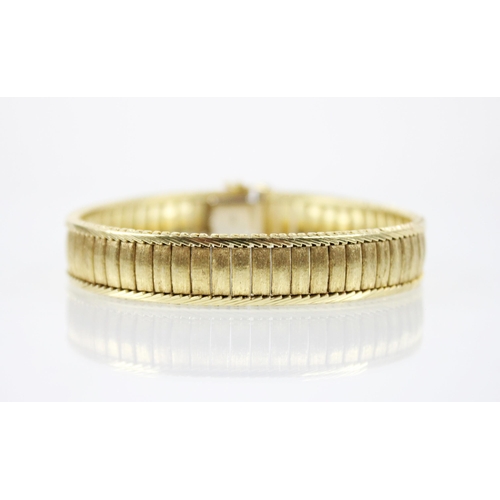 222 - An 18ct gold continental bracelet, the rectangular link bracelet with textured finish, herringbone b... 