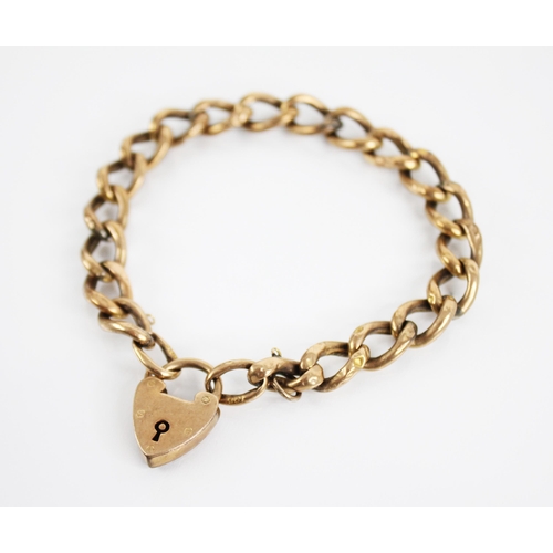 229 - A gold coloured curb link bracelet, jump rings stamped '9ct', with a heart shaped padlock fastener, ... 