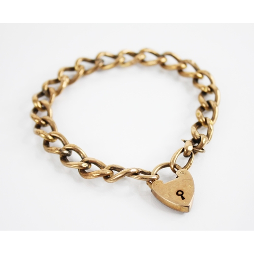 229 - A gold coloured curb link bracelet, jump rings stamped '9ct', with a heart shaped padlock fastener, ... 