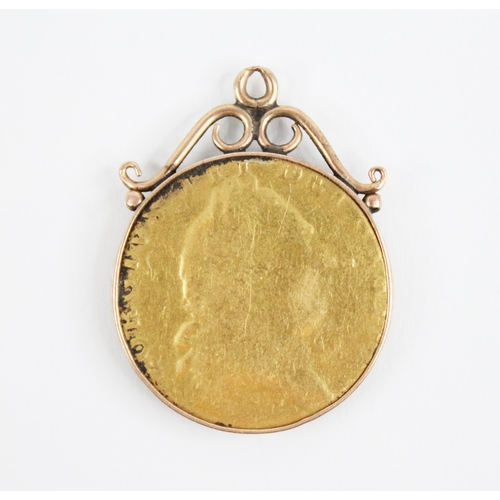 249 - A George III spade guinea, set to a gold coloured pendant mount, weight 9.1gms