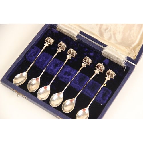 14 - A set of six silver coloured coffee spoons, each with terminals modelled as elephants, 9.7mm long, t... 