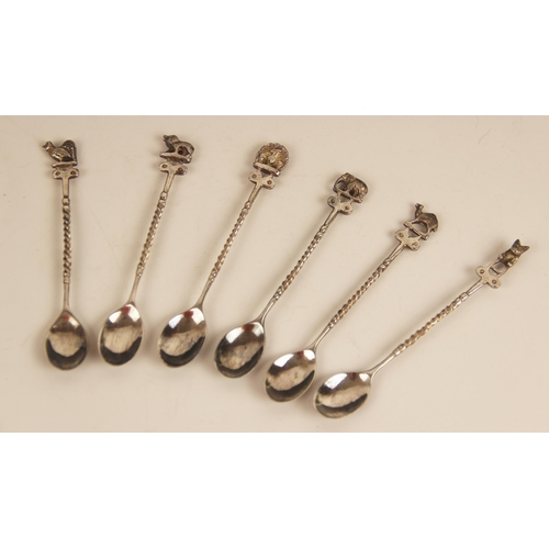 14 - A set of six silver coloured coffee spoons, each with terminals modelled as elephants, 9.7mm long, t... 