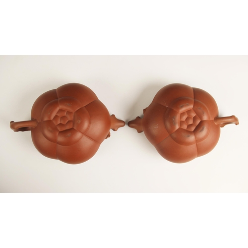 375 - A pair of Yixing teapots and covers, early 20th century, each of compressed hexagonal form and appli... 