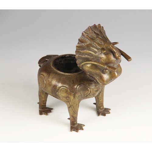 404 - A Chinese bronze 'Luduan' incense burner, modelled standing on four legs with hinged head forming th... 