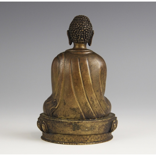 415 - A bronze model of Buddha, possibly Sino-Tibetan, 18th/19th century, modelled seated in dhyanasana on... 