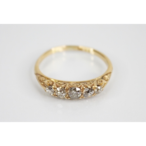 135 - An Edwardian five stone diamond ring, the central old cut diamond measuring 3.8mm W x 2.43mm D, with... 