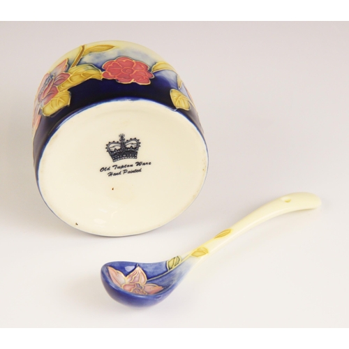 139 - An Old Tupton ware honey pot, cover and spoon, tube lined and hand painted with a continuous floral ... 