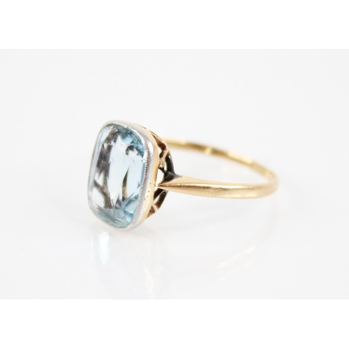 191 - An aquamarine ring, the central mixed cut aquamarine measuring 11.5mm x 9mm x 5mm, all set in yellow... 