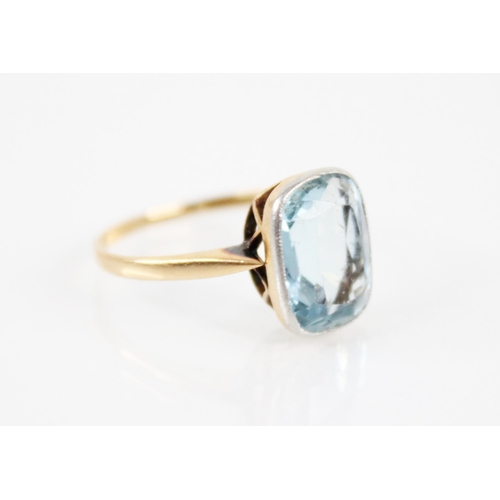 191 - An aquamarine ring, the central mixed cut aquamarine measuring 11.5mm x 9mm x 5mm, all set in yellow... 