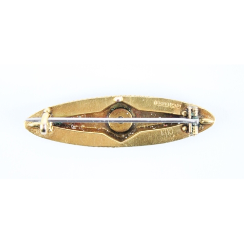 226 - A Victorian 15ct gold diamond set brooch, the Etruscan style brooch of navette form with applied flo... 