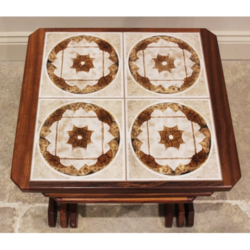 253 - A nest of three teak G Plan tables, mid 20th century, the largest example inset with four geometric ... 