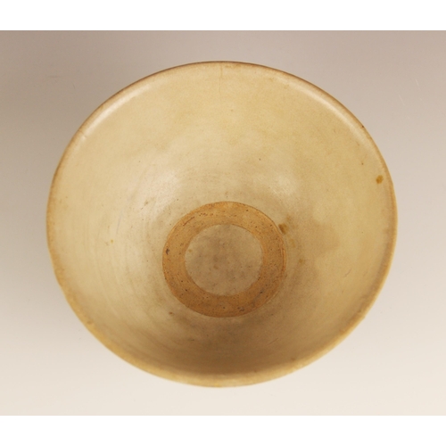 379 - A Vietnamese pottery bowl, possibly 16th century, the circular bowl of conical footed from with an e... 