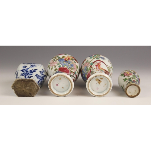 394 - A pair of Chinese porcelain vases and covers, 20th century, in the famille rose palette and of balus... 