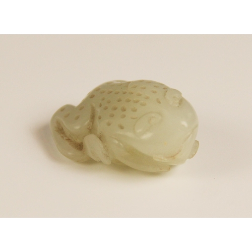 427 - A Chinese pale jade toad, 19th century, the celadon coloured carving modelled grasping a fruiting vi... 