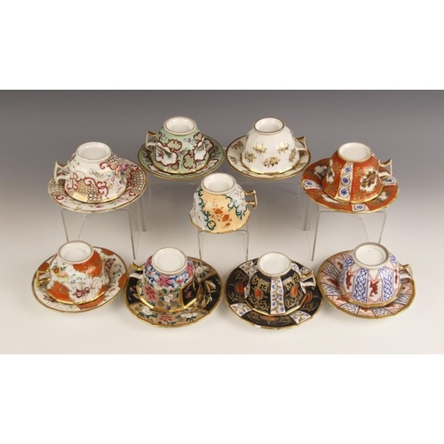 448 - A selection of porcelain teacups and saucers, 19th century, each of faceted London shape with flared... 