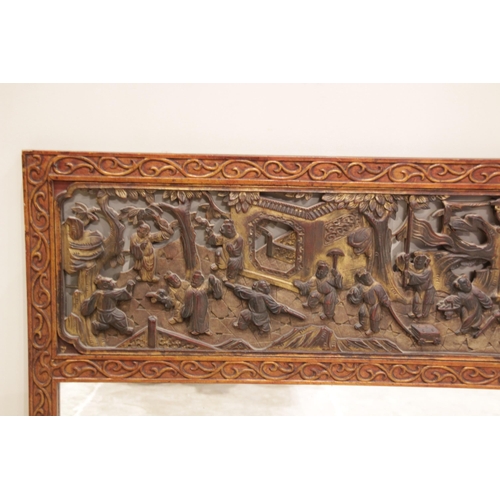 602 - A Chinese carved hardwood and gilt lacquered over mantel mirror, early 20th century, the rectangular... 