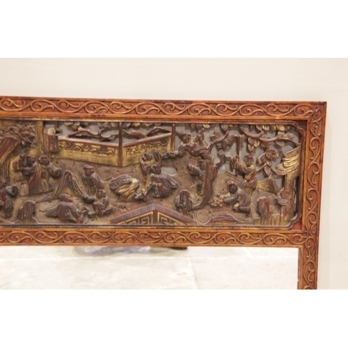 602 - A Chinese carved hardwood and gilt lacquered over mantel mirror, early 20th century, the rectangular... 