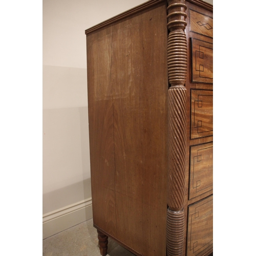 634 - A near pair of late George III mahogany bowfront chests of drawers, circa 1810, each chest with a cr... 