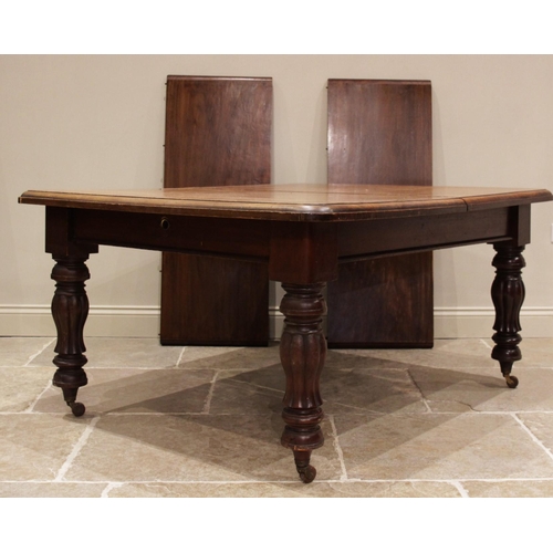 684 - A Victorian mahogany extending dining table, the rectangular moulded top with rounded corners, upon ... 