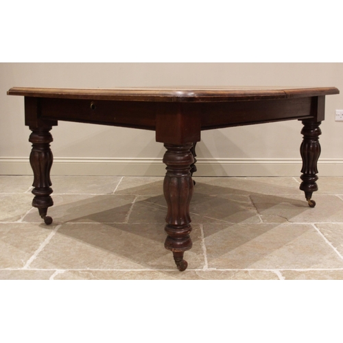 684 - A Victorian mahogany extending dining table, the rectangular moulded top with rounded corners, upon ... 