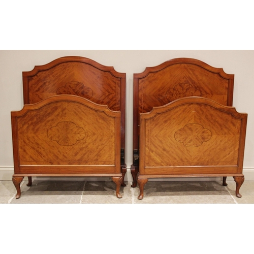 692 - A pair of mahogany single beds, in the manner of Maple & Co, early 20th century, the quarter veneere... 