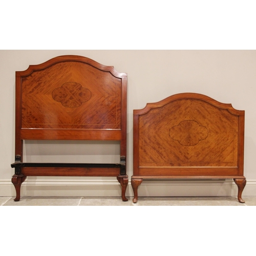 692 - A pair of mahogany single beds, in the manner of Maple & Co, early 20th century, the quarter veneere... 