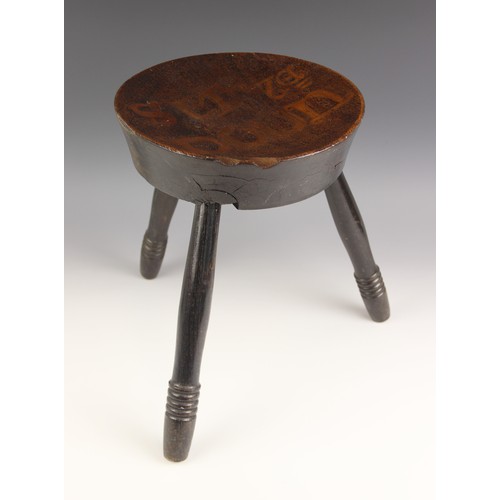 70 - An Arts and Crafts rustic poker work 'Sit Ya Down' stool, possibly Scottish, the circular slab dish ... 