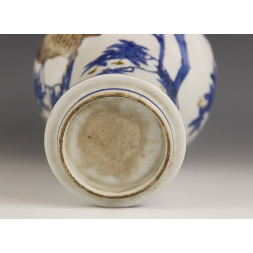 422 - A Chinese porcelain vase, 19th century, the inverted baluster shaped vase decorated with an owl perc... 