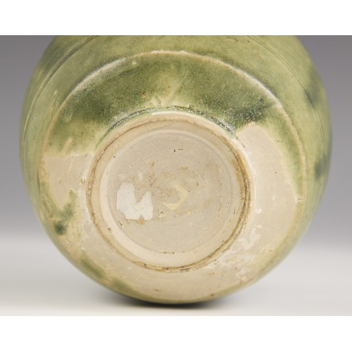 378 - An Anamese pottery vessel, possibly 15th century, the cylindrical vase celadon glazed to the interio... 