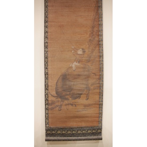 401 - A Chinese bamboo scroll painting (20th century), depicting a boy on a buffalo flying a kite, signed,... 