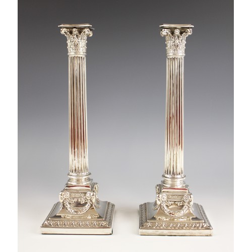 108 - A pair of Edwardian silver candlesticks, Elkington & Co, Birmingham 1901, the weighted square bases ... 