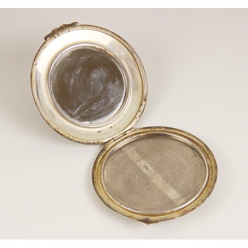 83 - A George VI Art Deco silver compact, W I Broadway & Co, Birmingham 1946, of circular form with engin... 