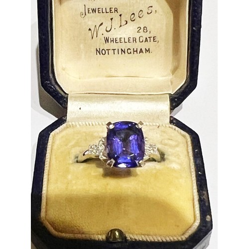 207 - A colour-change sapphire and diamond ring, the rectangular cushion mixed cut sapphire weighing 4.20 ... 