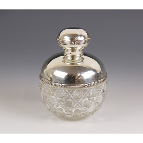 115 - An Edwardian cut glass silver mounted scent bottle, Birmingham 1909 (maker's mark worn), of globular... 