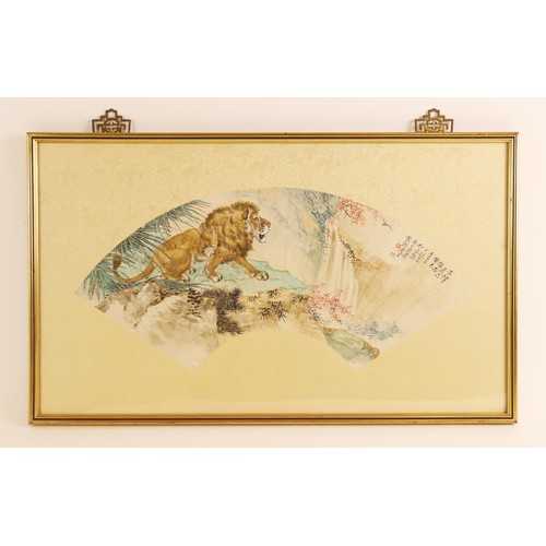 399 - Chinese School (20th century), watercolour laid on silk fan painting, depicting a lion on a rocky ou... 